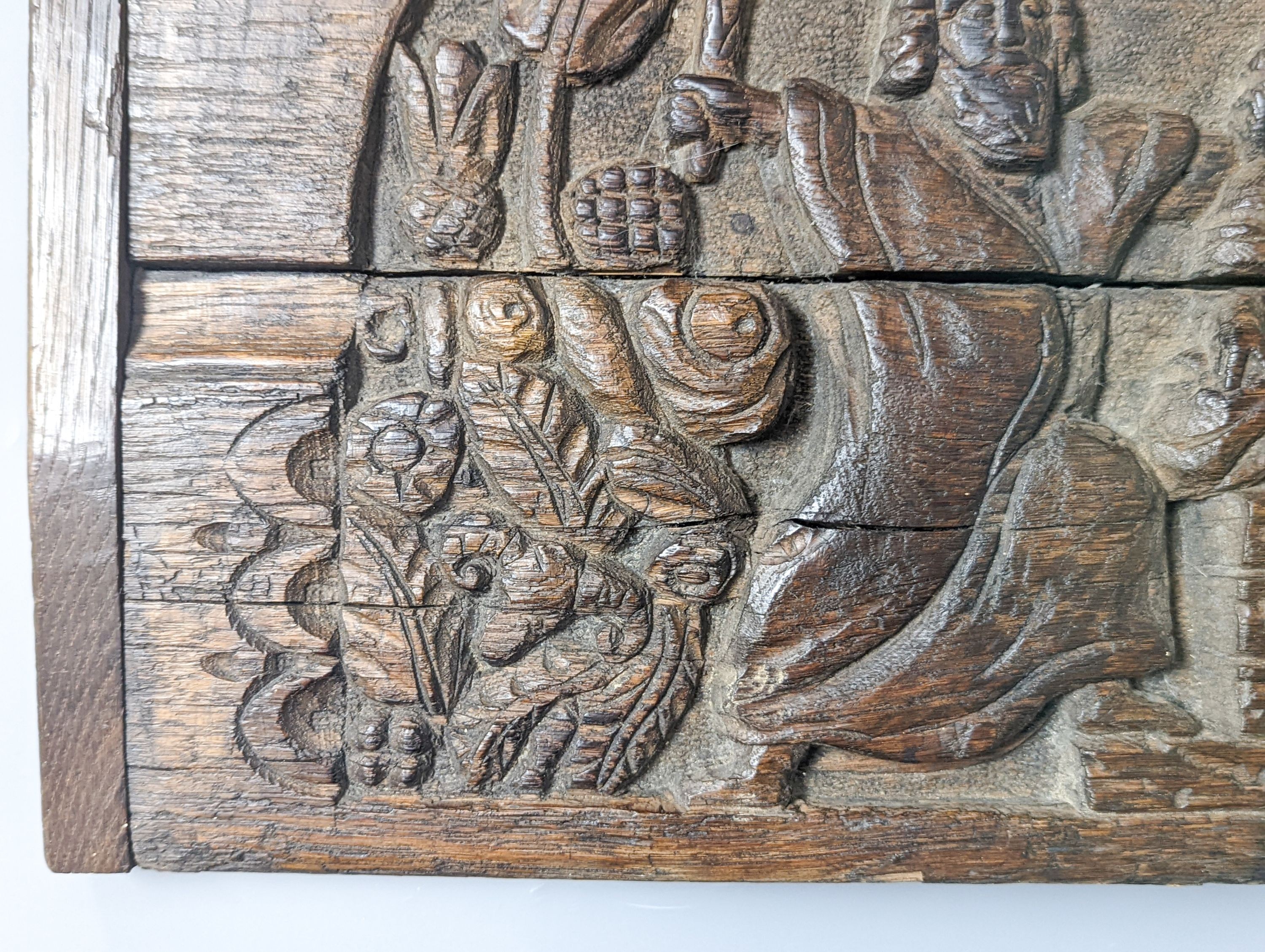A 17th century style sunken-carved oak panel 37x61cm